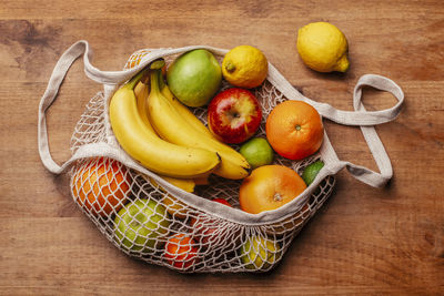 High angle view of fruits in basket on table