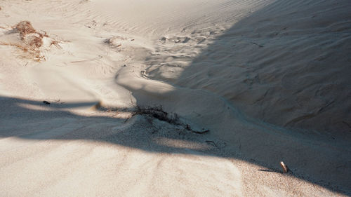 High angle view of sand dunes at beach