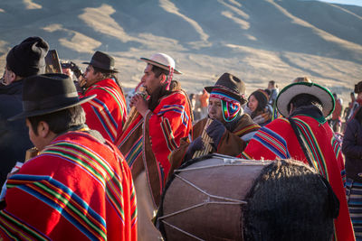 Group of people standing by the road