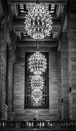 Low angle view of illuminated chandelier hanging