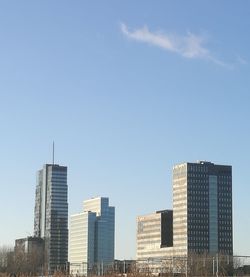 Skyscrapers in city against sky