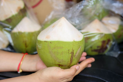 Close-up of hand holding fruit