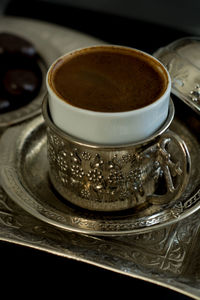 Close-up of coffee cup on table