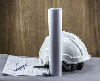 Close-up of coffee cup on table against wall