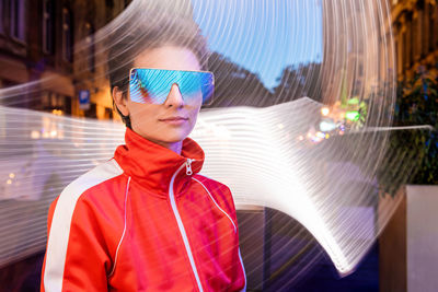 Portrait of young woman outdoor on long exposure freeze light 