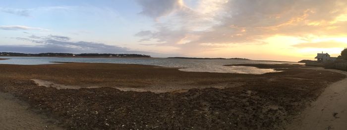 Scenic view of beach at sunset