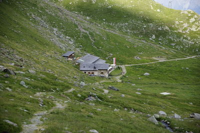 High angle view of houses amidst buildings