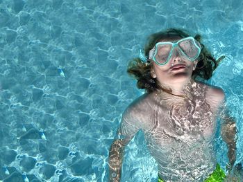 Youth swimming in swimming pool