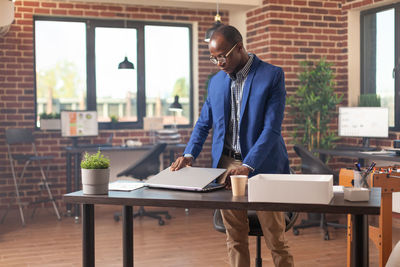 Young man using laptop at office