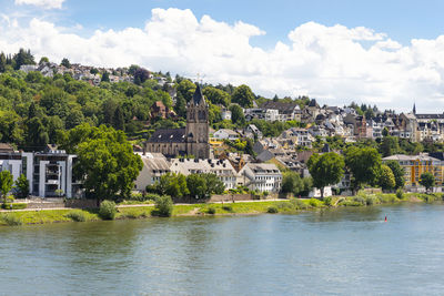 An old, historic city on the banks of the river rhine in western germany,  buildings and church.