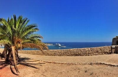 Scenic view of calm sea against clear sky