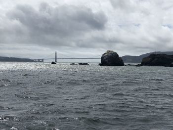 Bridge over sea against sky
