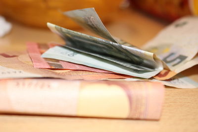 Close-up of paper currency on table