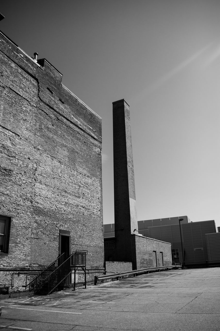 LOW ANGLE VIEW OF FACTORY AGAINST SKY