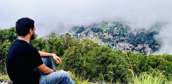 Young man looking at mountains