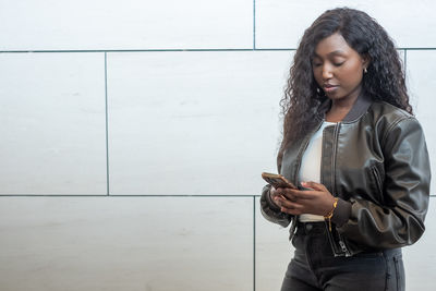 Young woman using mobile phone