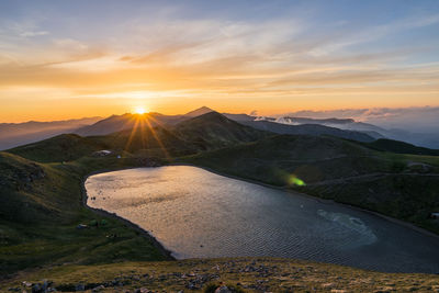 Scenic view of mountains against sky during sunset