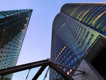 Low angle view of skyscrapers against clear sky