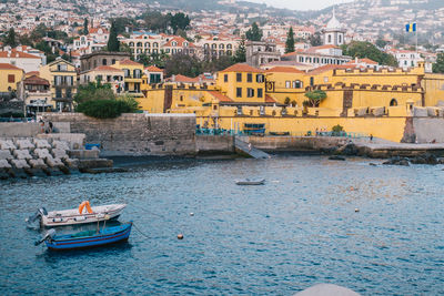 Boats moored in a city