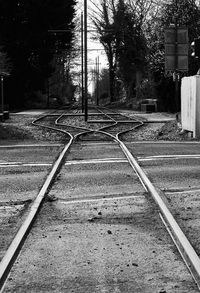 Railroad tracks by street in city