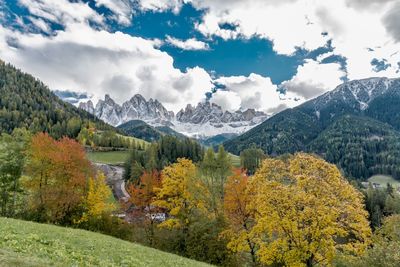 Scenic view of mountains against cloudy sky