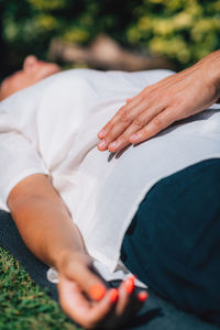 Reiki healing treatment. a therapist is performing a reiki energy healing treatment 