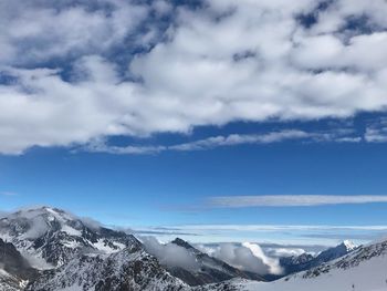 Scenic view of snowcapped mountains against sky