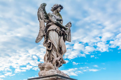 Low angle view of statue against sky