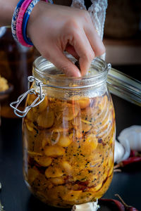 Close-up of hand holding pickle