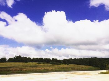 Scenic view of landscape against cloudy sky