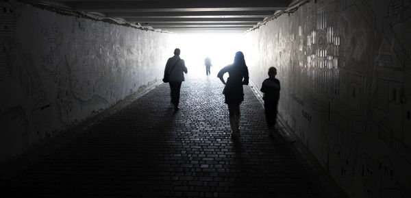 People walking in tunnel