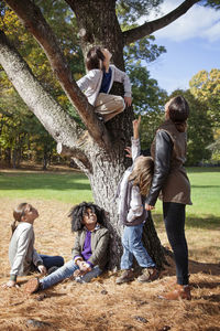 Children enjoying with teacher at field trip