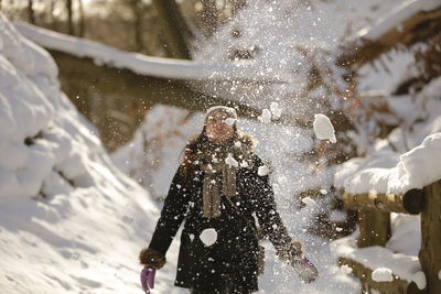 Rear view of woman in snow