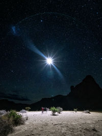 Scenic view of landscape against sky at night