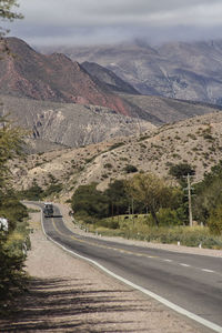 Scenic view of mountain road against sky