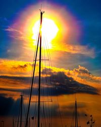 Silhouette sailboat on sea against sky during sunset