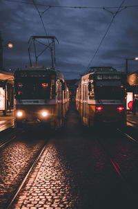 Train on railroad tracks against sky at dusk