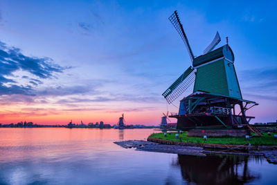 Windmills at famous tourist site zaanse schans in holland with dramatic sky. zaandam, netherlands