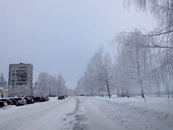 Road passing through snow covered landscape