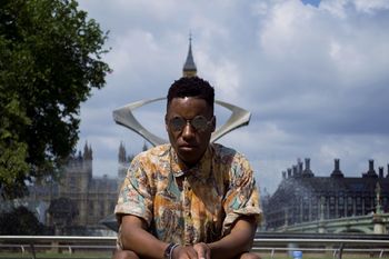 SILHOUETTE OF WOMAN LOOKING AT CITY AGAINST SKY