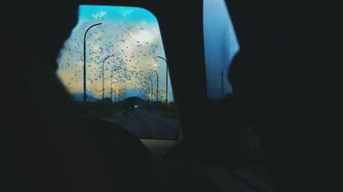 Close-up of silhouette car window