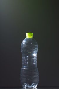 Close-up of light bulb against black background