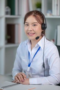 Portrait of female doctor working in office