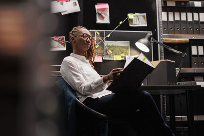 Portrait of woman using laptop while sitting at home