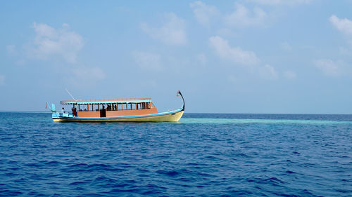 Boat in sea against sky