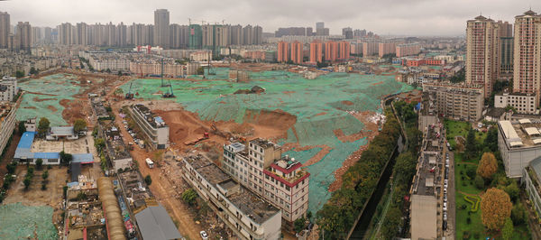 High angle view of buildings in city against sky