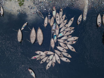 Aerial view of wooden passenger boats along the buriganga river, keraniganj, dhaka, bangladesh