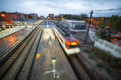 High angle view of train at railroad station in city