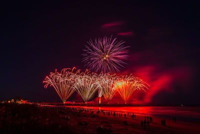 Firework display at night