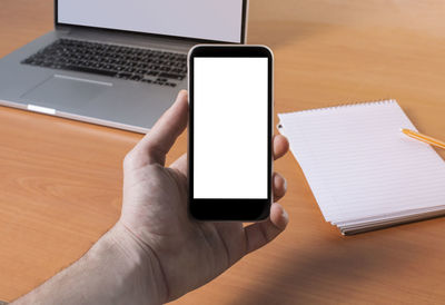 High angle view of mobile phone on table